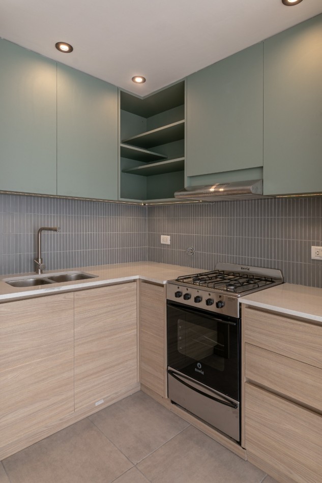 DEPARTAMENTO DE 2 AMBIENTES EN PLANTA BAJA CON JARDIN Y PARRILLA.